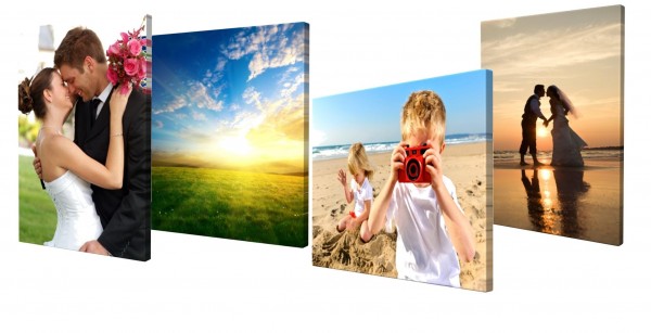 Four galley framed canvas prints showing a wedding pic of couples, vacation photos of children playing on the beach and a nature pic of a rising sun.