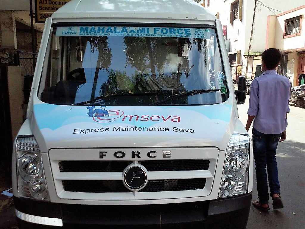 Front view of a tempo displaying MSeva company vehicle branding using printable air release media