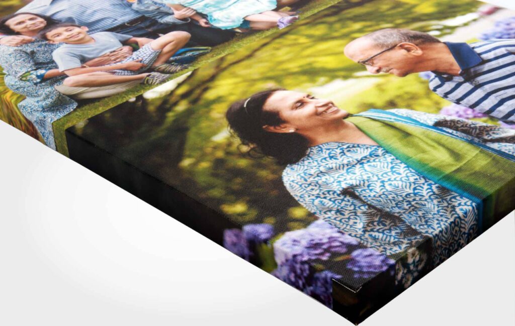 Side view of a canvas print stretched on a frame showing a collage of family pictures