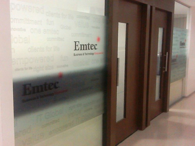 Emtech company logo printed on frosted film and pasted on a glass partition in their office