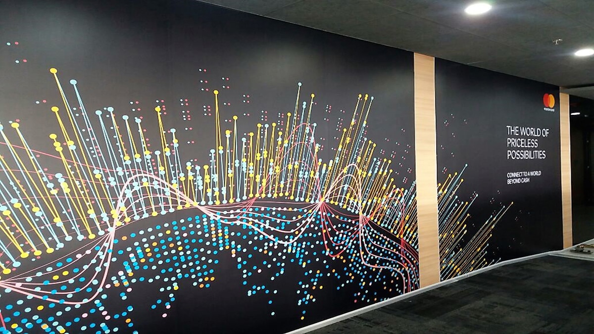 Image of a large-sized custom wallpaper installed in an office. PVC wall stickers are a great office design idea to showcase your corporate imagery in your workplace.