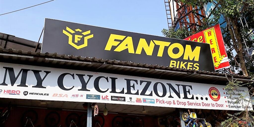 fabricated backlit sign board for the Fantom cycle shop with lights innstalled within
