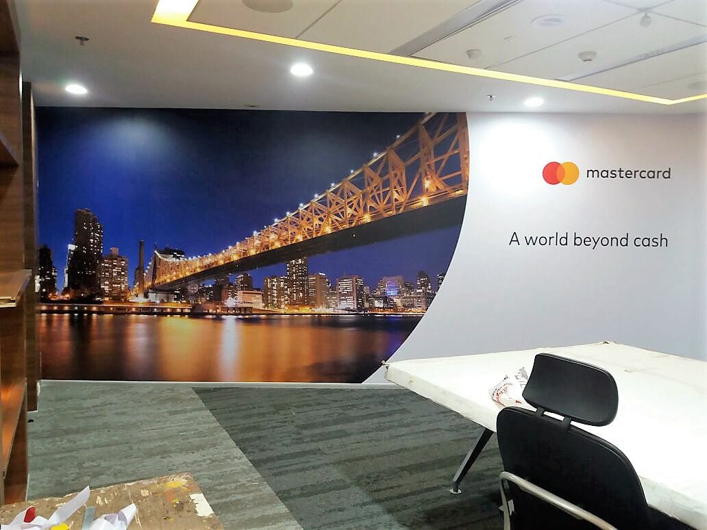 office decor ideas to improve the looks of a conference room by using custom printed wallpapers showing a personalised design