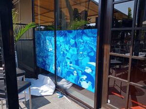 printed window decals for privacy using high resolution inkjet printed vinyl pasted on the front partition of a cafe