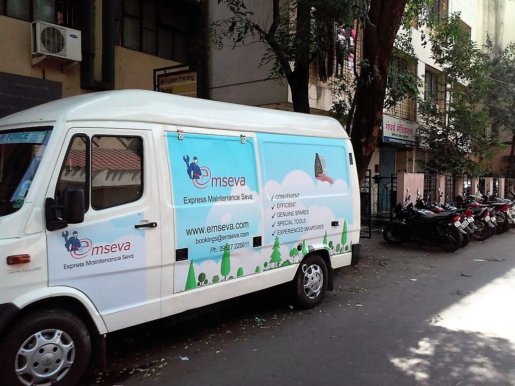 Custom designed vehicle branding done on the side of a tempo traveller belonging to MSeva company