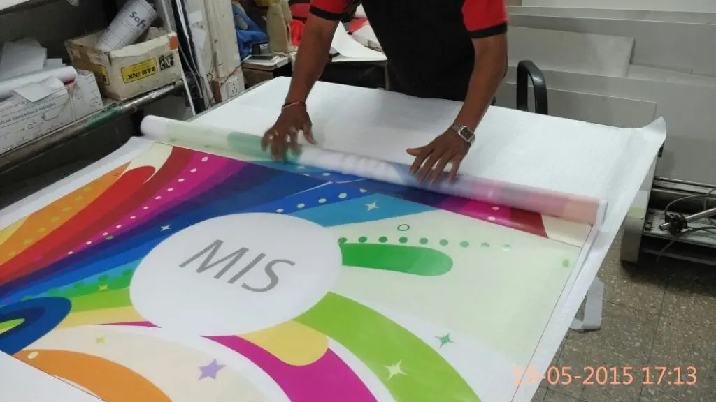 Roll of light weight satin cloth which has been printed with a personalised design of a flag