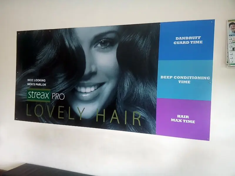 store branding done at a streax beauty salon using photo vinyl with sunboard pasted on the wall