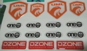 Dome stickers. Shape-cut as per your logo. Raised 3D effect.