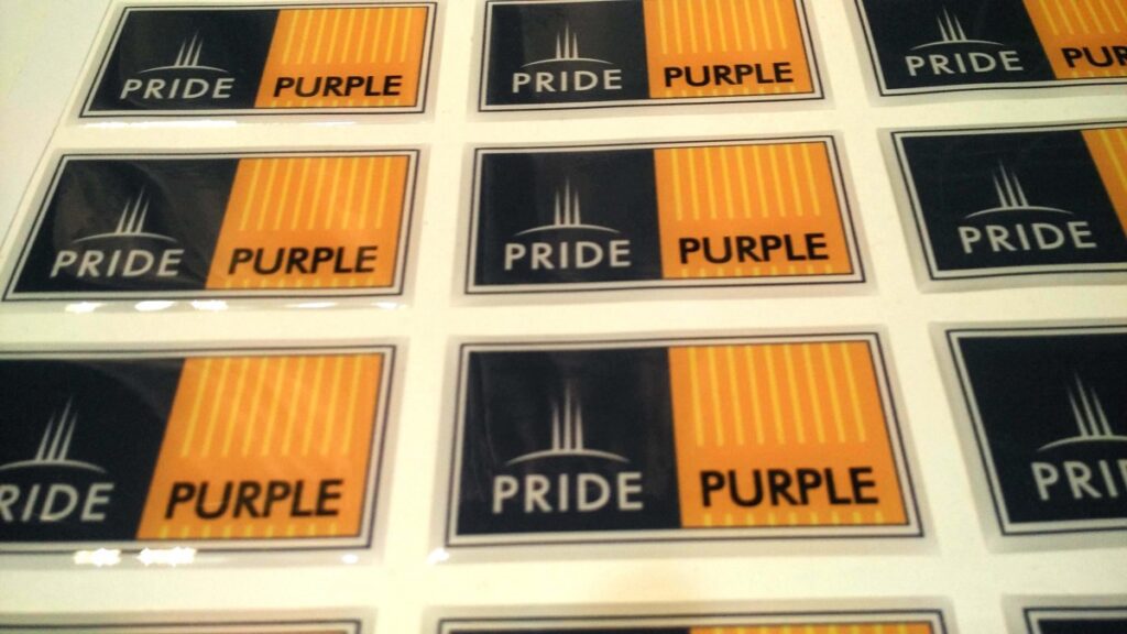 dome stickers made of the Logo of Pride Purple using a liquid clear epoxy