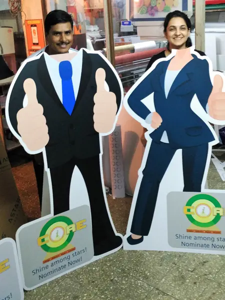 Life size cardboard cut out stand shaped in the form of a cartoon and cut on a CNC machine to enable people to stand behind the cutout for selfies and photographs in parties and events
