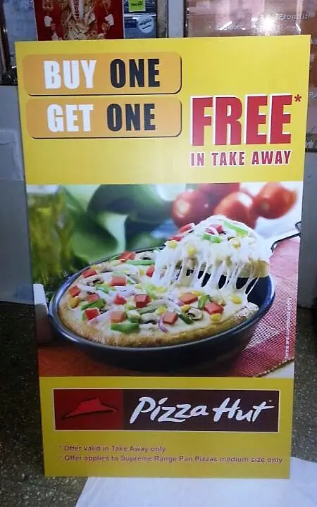 front view of a printed sunboard standee showing an ad for a Pizza Hut product