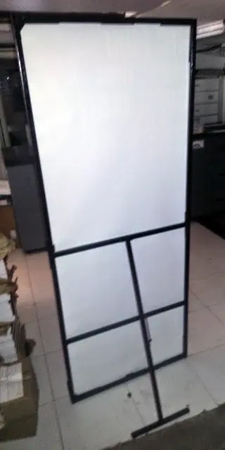 back view of a large life sized sunboard standee supported by a metal frame which can be folded