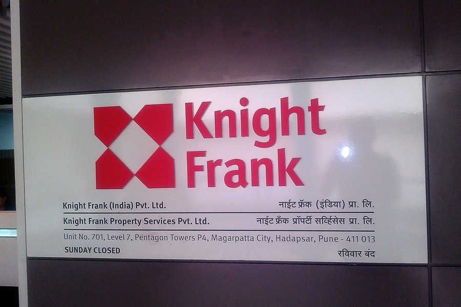 This image shows an acrylic name plate for the company Knight Frank made using ACP back board with acrylic cut letters and vinyl logo pasted onto the board