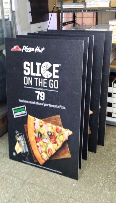 5 sunboard standees placed one behind the other made of laminated photo vinyl prints pasted on top of rigid foam sheet advertising for pizza hut slice on the go product