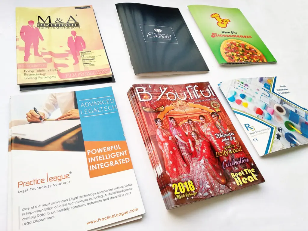 stack of magazines and brochures printed on a four color digital press