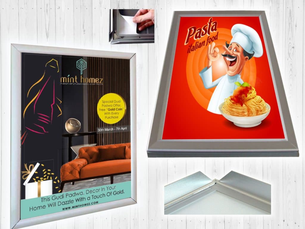 an aluminium poster frame can be easily operated by simply snapping open the side profiles pulling out the old poster putting in the new one and closing edges as shown in this image