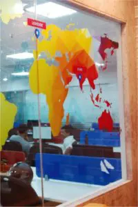 UV printed optically clear glass film print of the world map where the image of the continents is opaque and the rest of the area is transparent