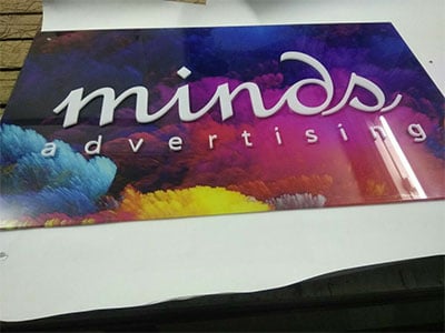 This image shows an acrylic name plate for advertising company, Minds Advertising.
