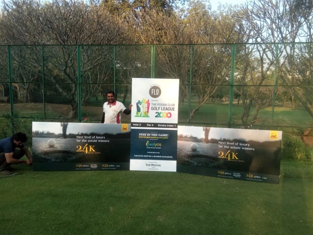 Flex printed event backdrop for the Pune Club Golf League event showing sponsors messages