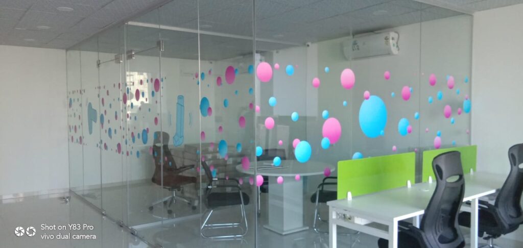abstract circular design printed on optically clear glass film using UV white inks creates a beautiful effect where the image is opaque and the rest of the film is transparent