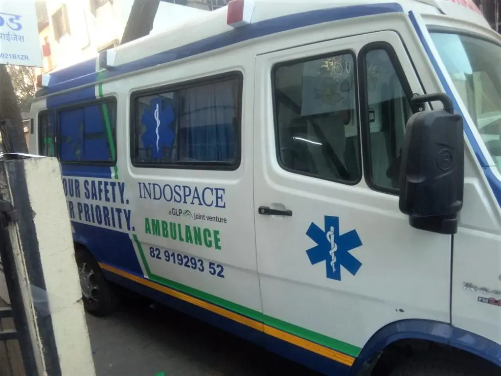 Side view of an ambulance of the Indospace company personalised by special UV printed vehicle wraps