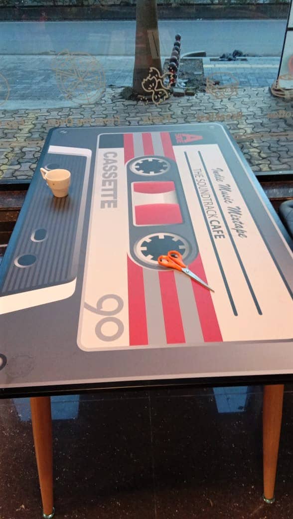 furniture printing on a table top is a great interior design idea for a music themed cafe