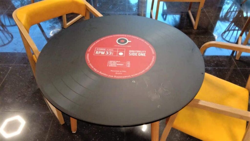 image of an LP record for advertising on a table top in a restaurant whose decor is based on a music theme