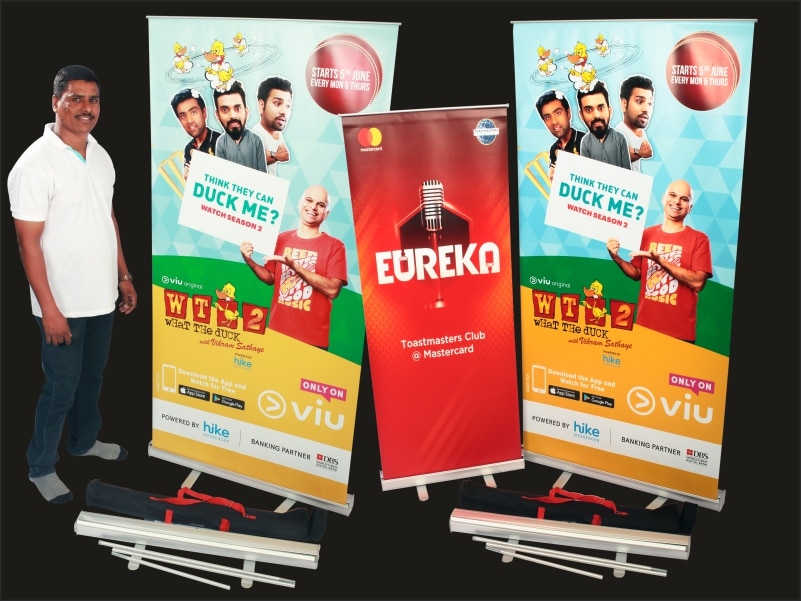 A roll up standee print With a high quality banner mounted on a collapsible frame that is six feet high and three feet wide
