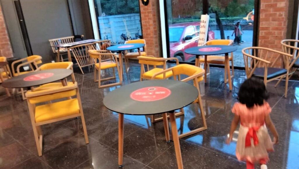 vinyl record images printed on the table top of a themed music cafe