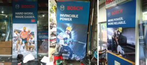 Three advertisement jobs of the Bosch tool company printed on SAV - self adhesive vinyl and pasted in a store