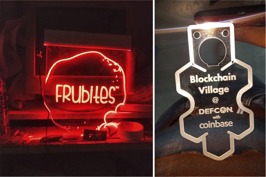 two acrylic panels laser engraved with company logos and side lit with LEDs to make the letters glow brightly