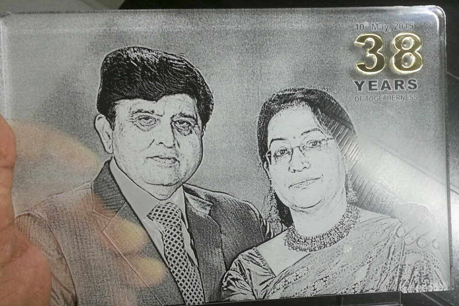 Picture of a middle aged couple laser engraved on a clear acrylic sheet to create a highly unique photo frame