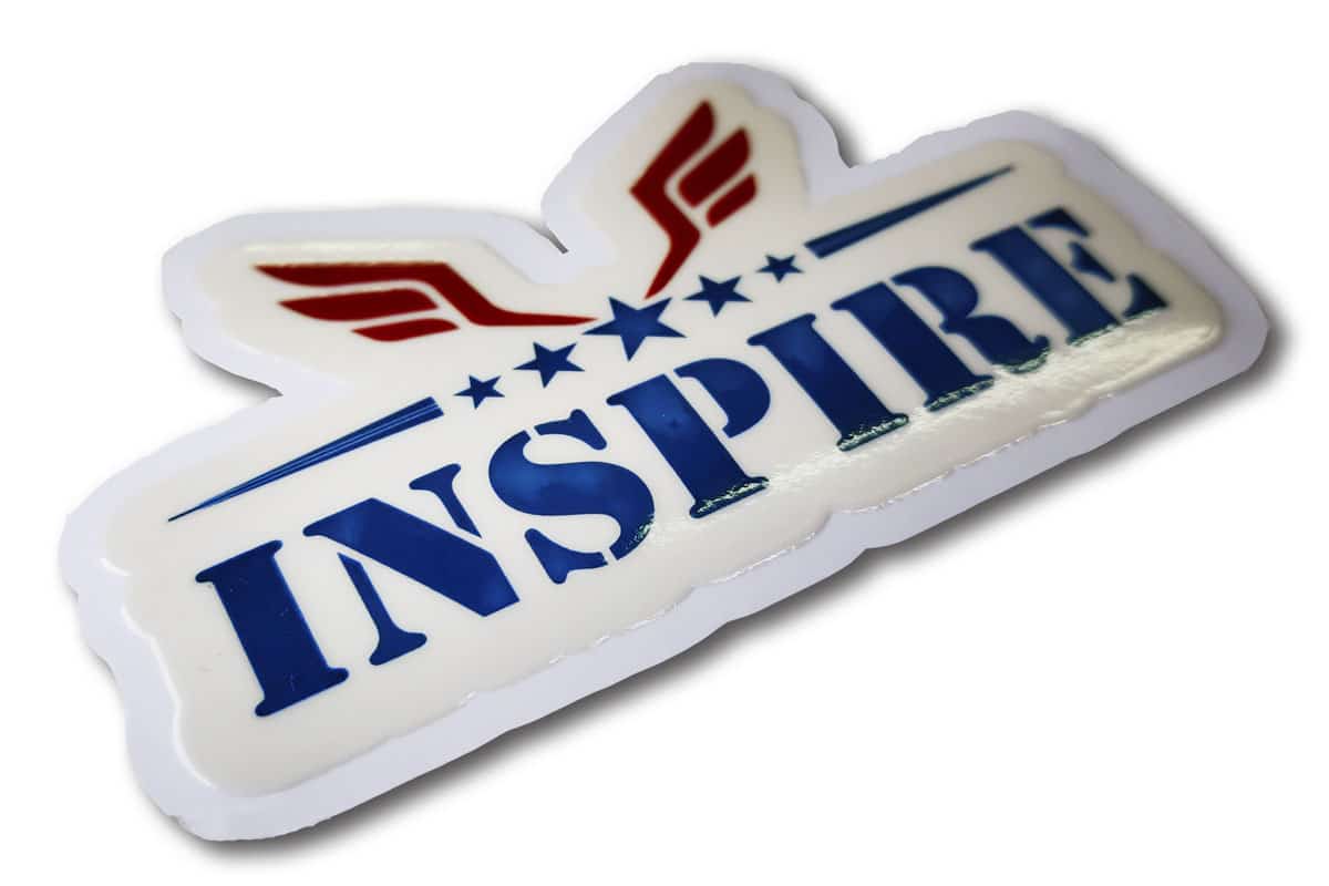 ‘Inspire’ logo shape cut and embossed. UV coated to give a raised effect