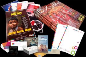 collage of corporate marketing materials stationery. Image showing brochures, leaflets, letterheads, VCs and posters