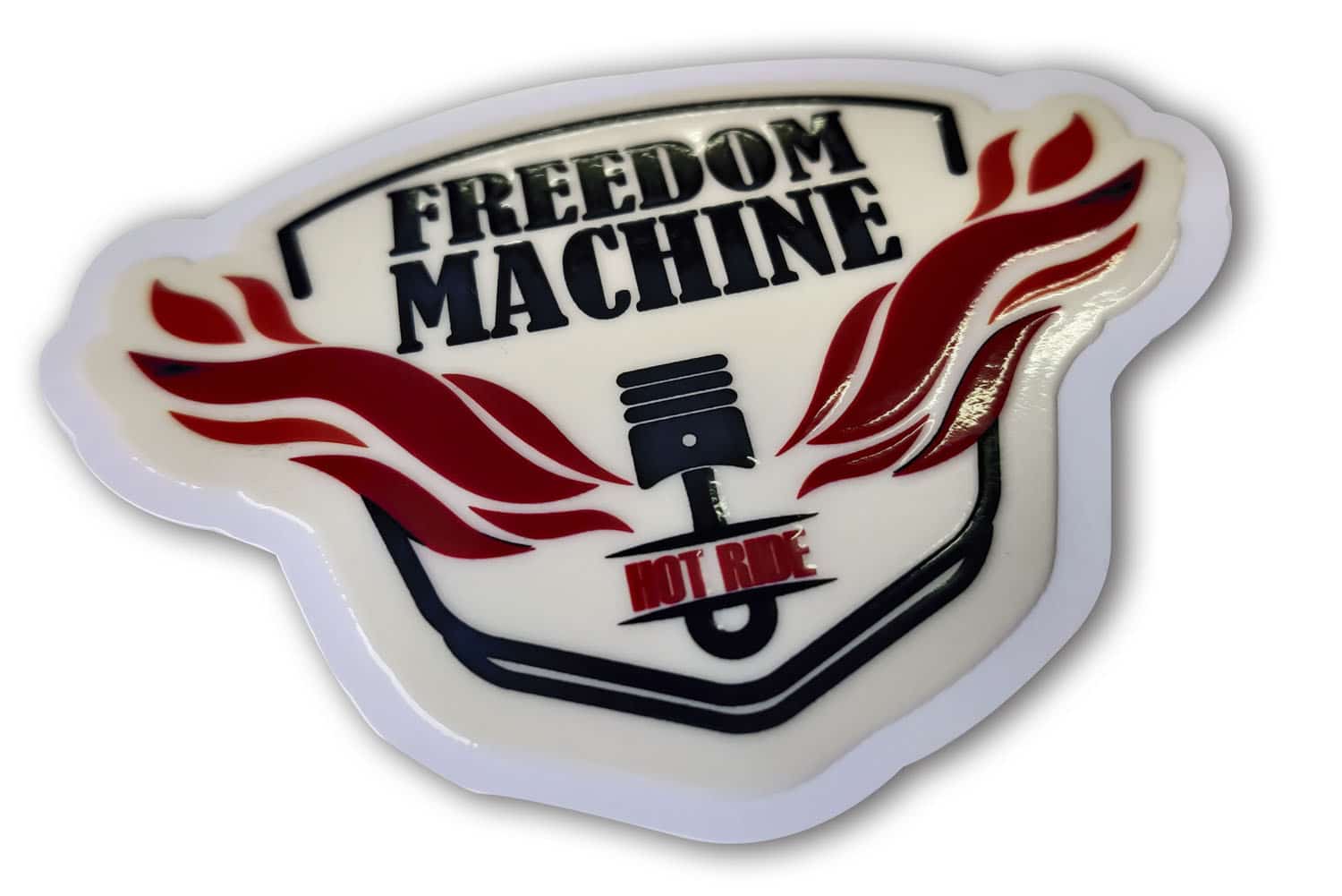 Shape cut sticker of the ‘Freedom’ brand logo given a raised, embossed effect using a UV ink coat