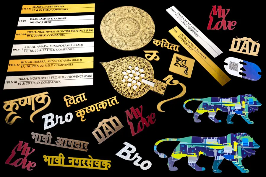 collage of products laser cut and engraved including cake toppers of paper, gold finish letters of acrylic, metal engraved plates, laser cut visiting cards, name plates, etc.