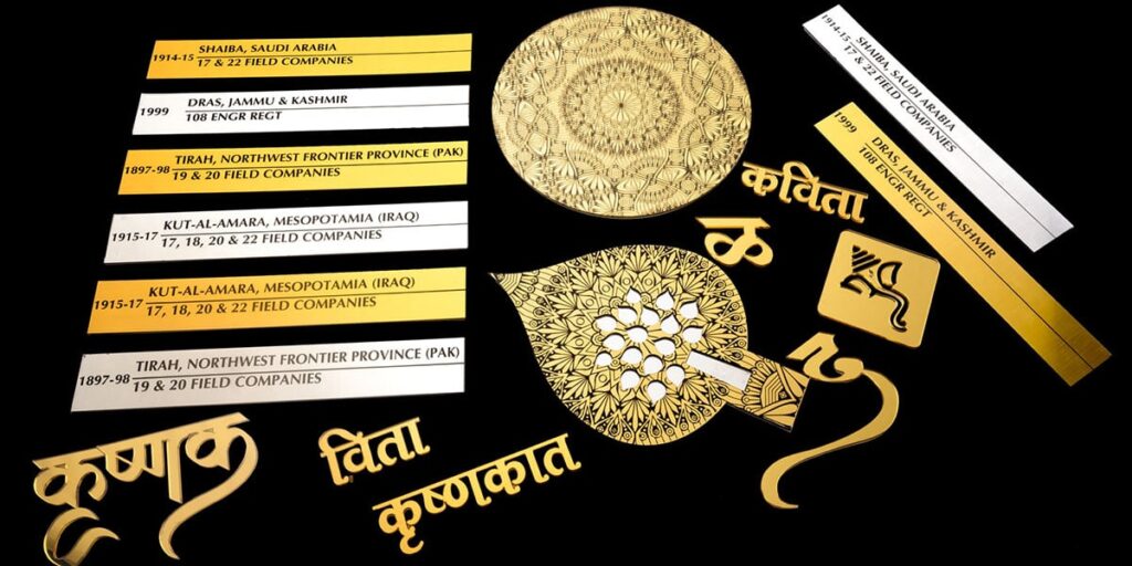 Gold and silver name plates laser engraved. Trophies cut from gold ply. Ganpati logo and marathi letters made from gold acrylic.