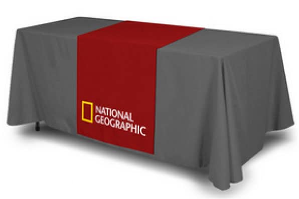 table runner printed with a company logo of the national geographic channel draped on a conference table