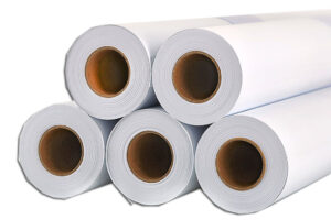Five white opaque self adhesive vinyl rolls stacked one on top of another