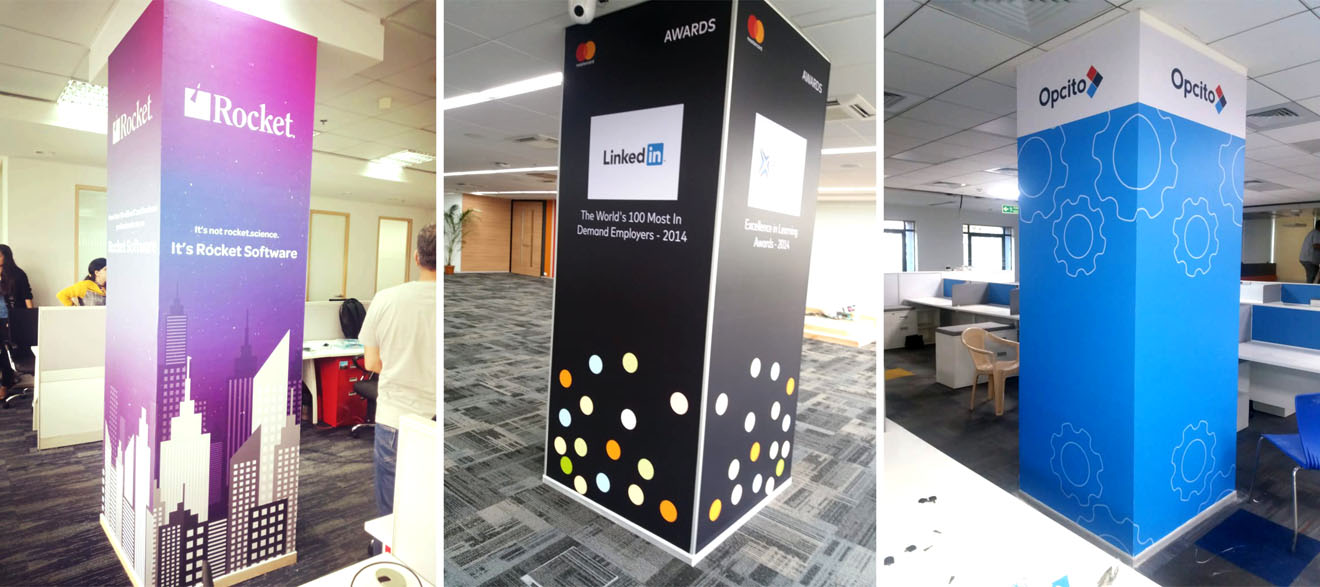 three pillars in the office of a software branded with the company logo pictures and product images using wall vinyl prints to significantly improve the looks of the office interior decor