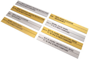 Small office interior design can benefit from the use of premium looking gold and silver laser engraved metal nameplates like the ones in this image displaying dates and names of places