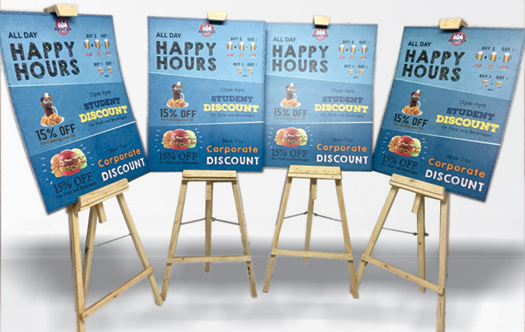 wooden easel standees with sunboard prints to catch the customers attention