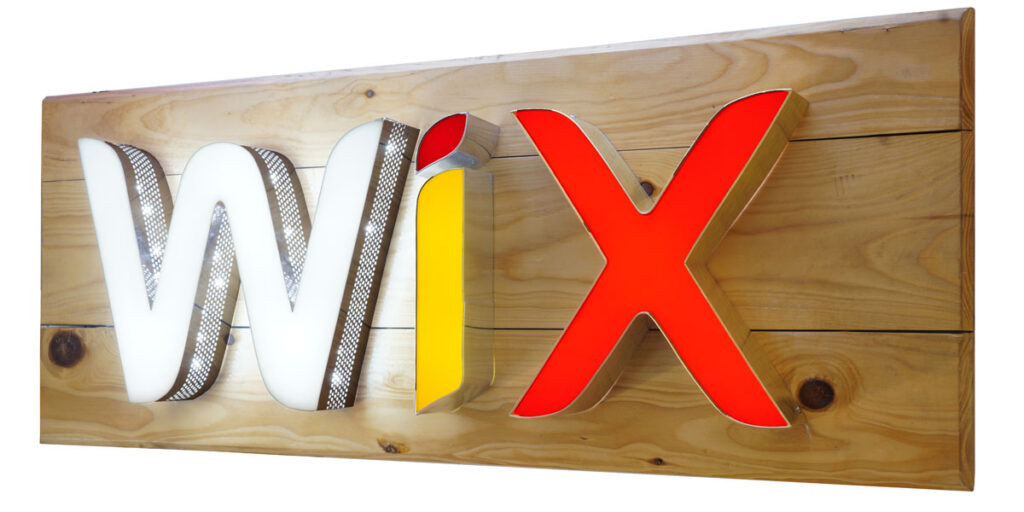 3D letters made with aluminium side channel and acrylic front surface laser cut to create the WIX logo. LED lights embedded inside the letters to glow the same. Perforated channel patti for the letter W with holes on the side