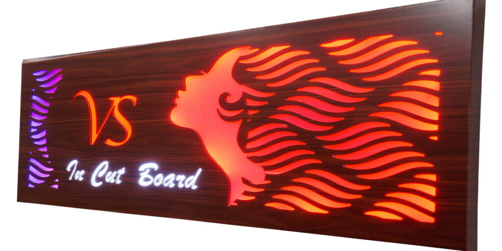 Design of beauty salon logo cut in 3 mm thick aluminium composite panel. Colored acrylic pasted from beneath. LEDs embedded inside the ACP box to give a very colorful glow to the acrylic letters