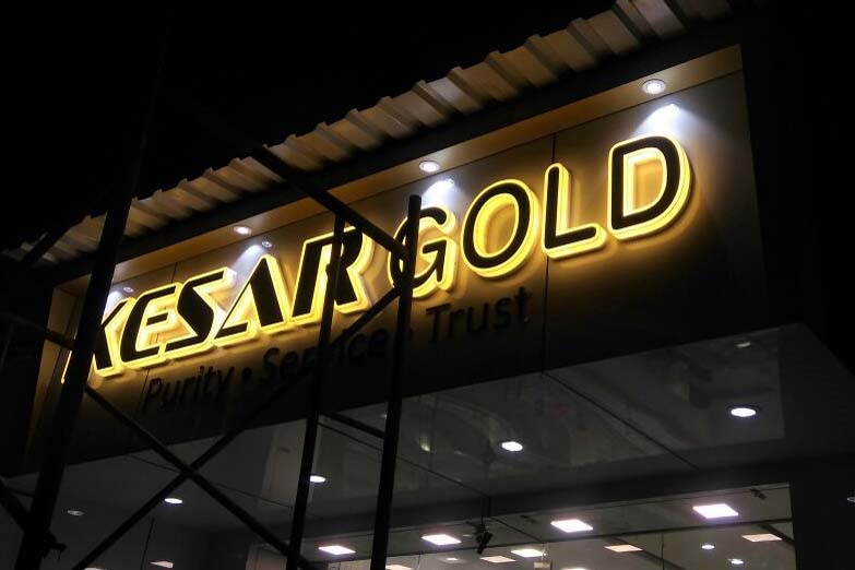 LED acrylic board for the Kesar Gold Jewellery store. Laser cut letters beautifully glowing from the sides and front with a warm white glow and outlining black acrylic letters on the front