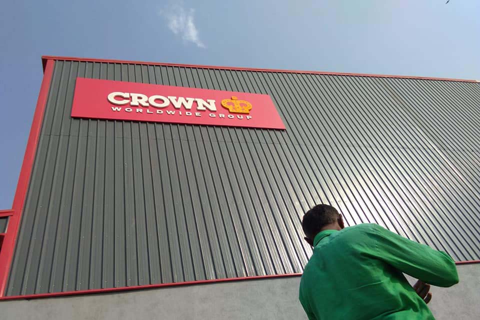 Logo board made of acrylic on an ACP frame for the Crown shipping company and installed on the side wall of their warehouse