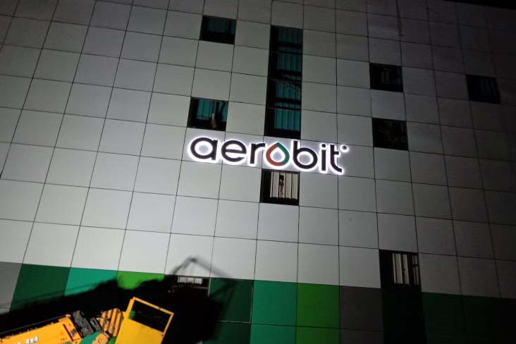 Sky sign of the Aerobit logo made out of metal letters with LEDs for a back glow. Name board installed on the side of a huge building