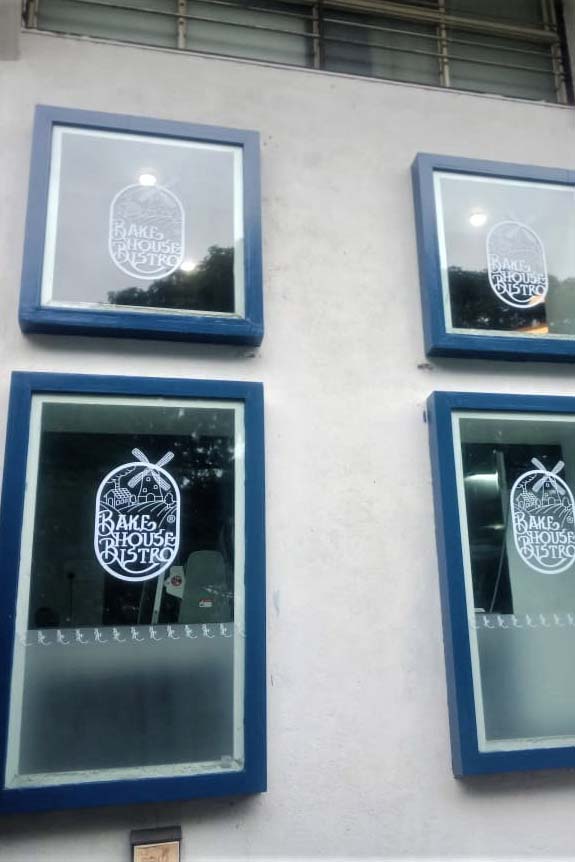The glass windows of a hotel decorated with designs printed by using UV white inks on a clear transparent vinyl