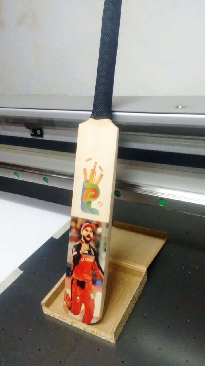 images printed on gift articles like a cricket bat using UV printing technology
