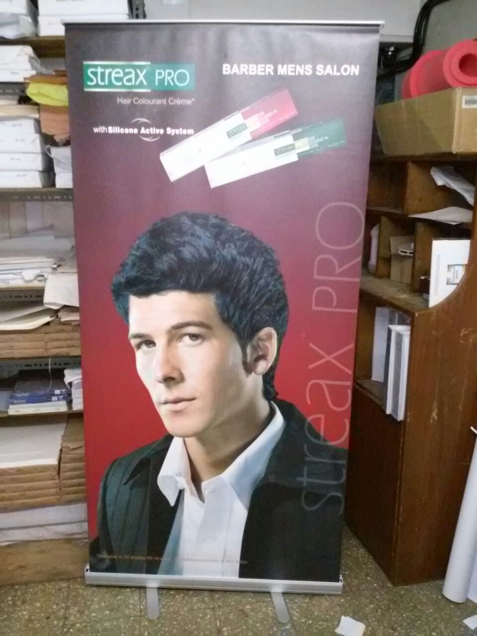roll up standee provided to a streax beauty salon to increase brand visibility